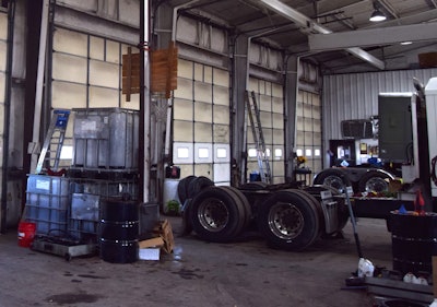 Photo of parts, trucks in fleet garage