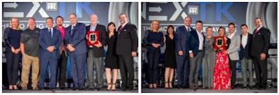 Two groups of people standing on a stage holding up awards.
