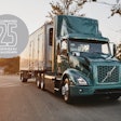 A Volvo truck on the road with a logo that says celebrating 25 certified EV dealerships.