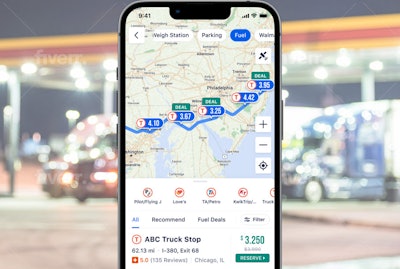 A screenshot of the Trucker Path app with a fuel station in the background.