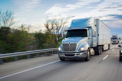 Blue International tractor on highway