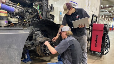 WyoTech students working on wheel end