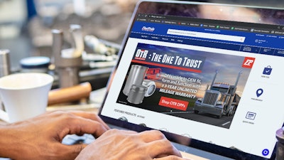 FleetPride associate using computer