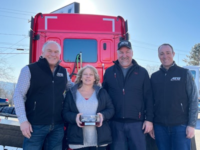 Advantage Truck Group announced the winners of the 2022 Pete DePina Legacy Award. From left are Advantage Truck Group President and CEO Kevin Holmes, service advisor Ellie Clauss, service manager Greg Hatfield, and Vice President of Network Truck Sales Chris Marsh.