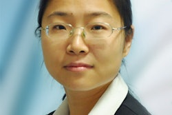 A picture of a Chinese woman wearing glasses and a suit.