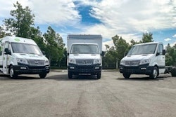 A trio of trucks in a lot.