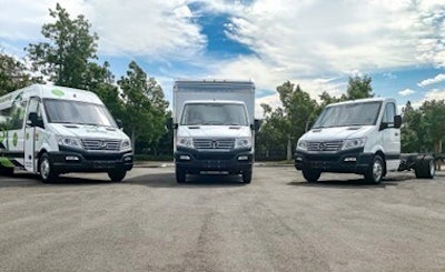 A trio of trucks in a lot.