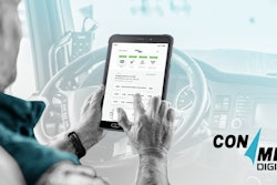 A driver in a truck with a tablet and a screenshot of ConMet Digital with a ConMet Digital logo.