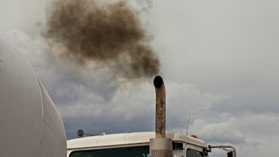 Truck blowing black smoke from exhaust