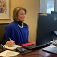 Sen. Shelley Moore Capito, R-West Virginia, sits at a desk and takes notes.