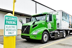 Electric truck parked next to a charging station