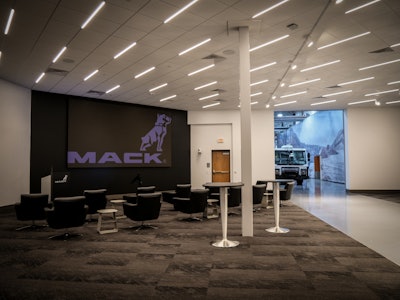 The new briefing room at the Mack Experience Center allows for Mack trucks to be driven into the room from the adjacent showroom floor.