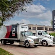 Two trucks in front of a building and a sign that reads PacLease TruckRental and Leasing.