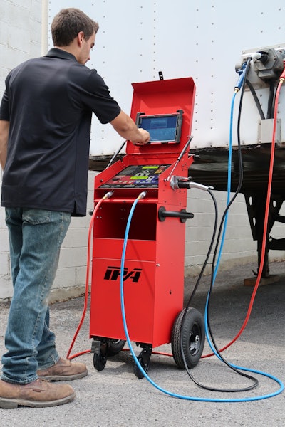 A technician operates an IPA diagnostic tool