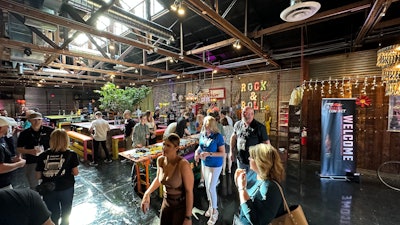 A light, bright restaurant full of people. A banner has the Diesel Connect logo and says welcome.