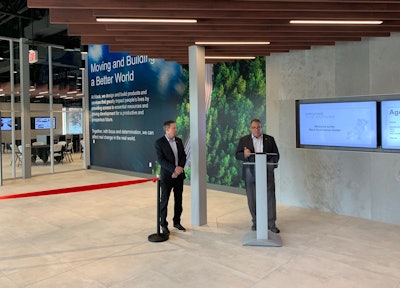 Mack Trucks North America President Jonathan Randall speaks before reporters and guests at the reopening of the Mack Experience Center in Allentown, Pennsylvania on Tuesday. David Galbraith, vice president of global brand and marketing for Mack Trucks, stands on the left. “We've developed a way in which the customers can engage not only with the services we provide, but also with their trucks. They can take a holistic view of everything in one place,' Randall said.