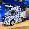 A hydrogen electric Class 8 truck from Quantron, covered in the blue-and-white Quantron logo.