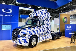 A hydrogen electric Class 8 truck from Quantron, covered in the blue-and-white Quantron logo.