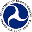 The U.S. Department of Transportation logo in blue, black and white.