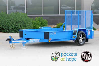 A bright blue trailer in a parking lot.