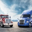Freightliner trucks isolated against the sky