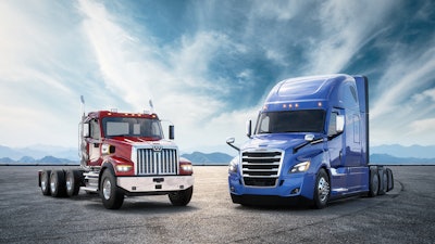 Freightliner trucks isolated against the sky