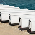 Row of white trailers on pier
