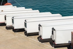 Row of white trailers on pier