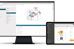 A computer monitor and tablet showing the Mitchell software for estimating collision repair.