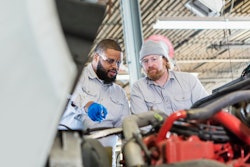 Two technicians working together