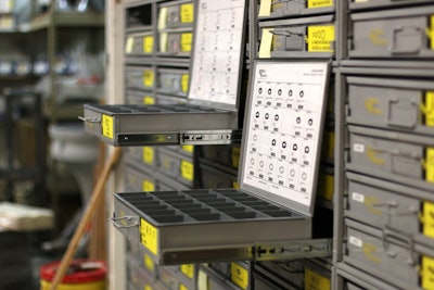 Drawers of parts at JE-CO with two open.