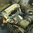 JE-CO techs work on a large piece of machinery.