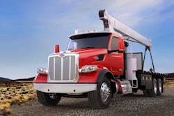 Peterbilt Model 567 with a crane on the back