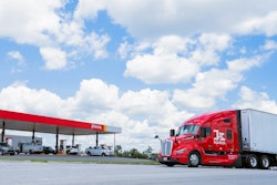 A red Kodiak truck outside of a Pilot truck center