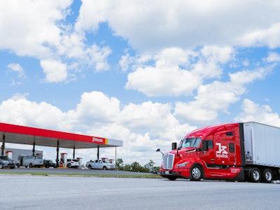 A red Kodiak truck outside of a Pilot truck center