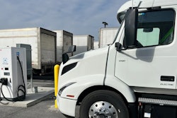 Volvo tractor being charged in a parking lot