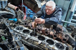 diesel mechanic working on engine