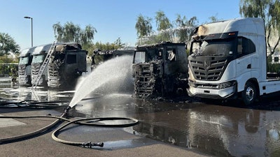 nikola semi truck being put out after fire