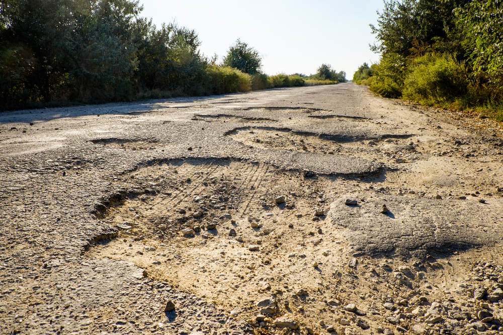 Bumpy road with potholes