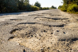 Bumpy road with potholes