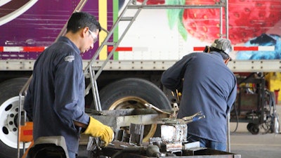 Stoops Trailers technicians at work in a service garage