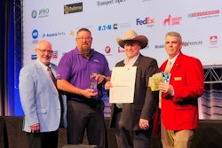 A group of men with an award, certificate and prizes at TMCSuperTech