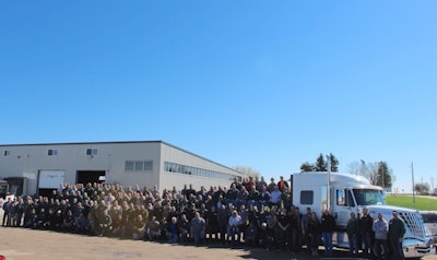 West Michigan International associates in front of business