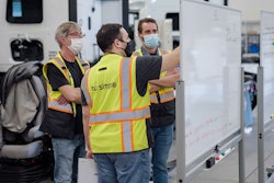 TuSimple employees working on a whiteboard