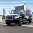 Freightliner electric truck at a charger