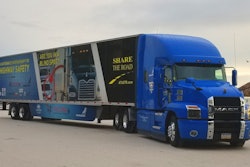 The electric blue Share the Road Mack Anthem.