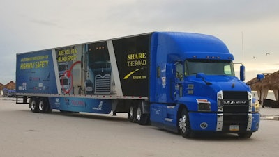 The electric blue Share the Road Mack Anthem.
