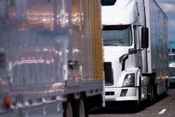 Trucks parked in a line on a highway