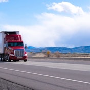 Truck on highway with Michelin retread tires
