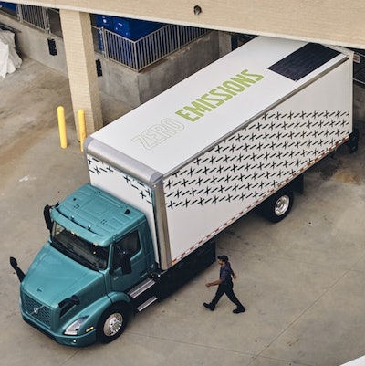 Volvo truck with zero emissions signage on trailer